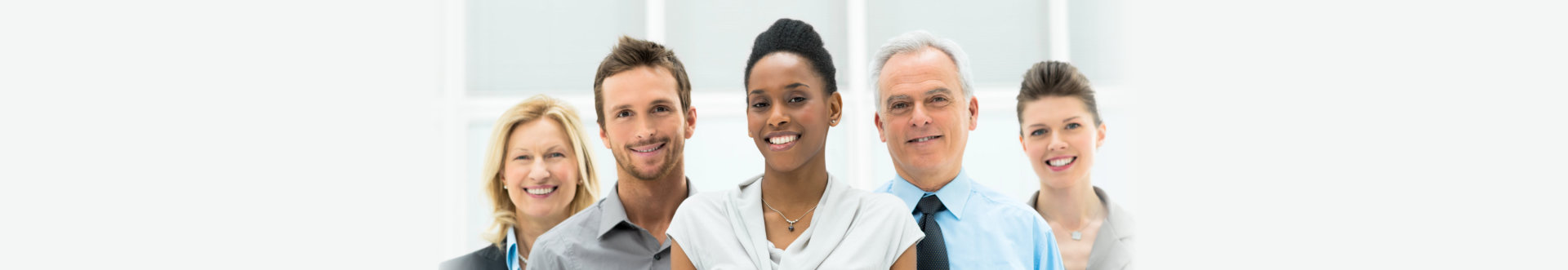 Smiling multi ethnic business team with copy space